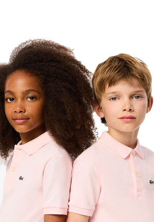Polo bambino Lacoste rosa chiaro in piquet di cotone | ViaMonte Shop
